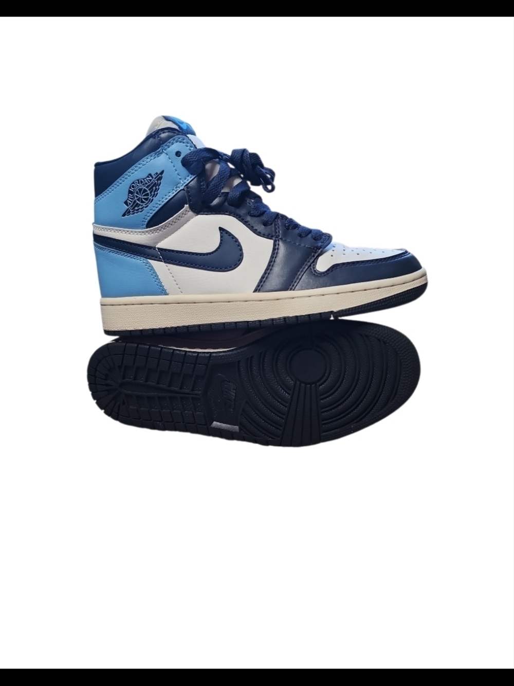 Nike Air Jordan 1 Retro High OG in the "Obsidian" colorway.